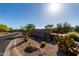 Scenic view of the 'Golf and Country Club' sign with cacti and lush greenery highlighting the community's beauty at 32627 N 70Th St, Scottsdale, AZ 85266