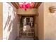 Charming gated entrance with blooming flowers and shade at 32627 N 70Th St, Scottsdale, AZ 85266