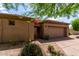 Charming single-story home featuring a well-maintained front yard, private gated entrance, and attached two-car garage at 32627 N 70Th St, Scottsdale, AZ 85266