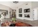 Bright living room with a fireplace, clerestory windows, neutral walls, and wood-look floors at 32627 N 70Th St, Scottsdale, AZ 85266
