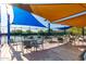 Inviting outdoor patio area with shaded seating, ideal for socializing and enjoying community activities at 32627 N 70Th St, Scottsdale, AZ 85266