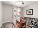 Cozy sitting room with a sofa, area rug, and access to outdoor patio area at 32627 N 70Th St, Scottsdale, AZ 85266