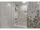 Stylish bathroom with tub, shower, subway tile surround, and niche at 334 W Medlock Dr # D102, Phoenix, AZ 85013