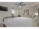 Bedroom with a queen-sized bed, ceiling fan, and natural light from the doorway at 334 W Medlock Dr # D102, Phoenix, AZ 85013