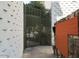 Decorative metal security gate with white block wall and privacy at 334 W Medlock Dr # D102, Phoenix, AZ 85013