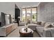 Cozy living room with large windows offering natural light and comfortable modern furnishings at 334 W Medlock Dr # D102, Phoenix, AZ 85013