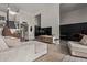 Modern living room with stylish furniture, open floor plan, and staircase leading to the upper level at 334 W Medlock Dr # D102, Phoenix, AZ 85013