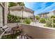 Charming patio with table, chairs, and view of the community pool at 334 W Medlock Dr # D102, Phoenix, AZ 85013