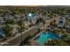 An aerial view showcases a well-maintained community, with a refreshing pool and lush palm trees at 3365 W Thude Dr, Chandler, AZ 85226