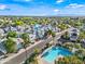 Beautiful aerial view of a neighborhood with a community pool and palm tree lined streets at 3365 W Thude Dr, Chandler, AZ 85226