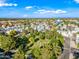 Aerial view of a neighborhood featuring mature trees, a manicured park, and access to paved walking paths at 3365 W Thude Dr, Chandler, AZ 85226