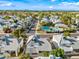 Beautiful aerial view of the neighborhood with community pool, tree-lined streets, landscaping, and mountain views at 3365 W Thude Dr, Chandler, AZ 85226