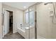 Bathroom features a shower and tub with tiled accents, and a walk-in closet at 3365 W Thude Dr, Chandler, AZ 85226