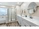 Spacious bathroom with double sink vanities and a glass-enclosed shower at 3365 W Thude Dr, Chandler, AZ 85226