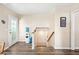 Hallway with new floors leading to the stairs and glass door to the backyard at 3365 W Thude Dr, Chandler, AZ 85226