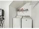 Laundry room with washer, dryer, and shelving for storage of supplies at 3365 W Thude Dr, Chandler, AZ 85226