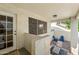 Enclosed patio features a covered space with outdoor furniture, a ceiling light and a doorway to the house at 3365 W Thude Dr, Chandler, AZ 85226