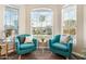Bright sitting area features stylish decor, cozy seating, and large windows allowing lots of natural light at 3365 W Thude Dr, Chandler, AZ 85226