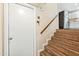 Stairway with wood treads leading to a kitchen featuring stainless steel appliances at 3365 W Thude Dr, Chandler, AZ 85226