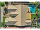 Aerial view of a home with a large pool, lush landscaping, and various outdoor entertainment features at 3552 E Dogwood Dr, Chandler, AZ 85286