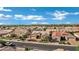 Expansive aerial view of a residential neighborhood with diverse rooftops and scenic mountain views at 3552 E Dogwood Dr, Chandler, AZ 85286
