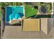 Aerial view showcasing a swimming pool, manicured grass, a trampoline and outdoor furniture at 3552 E Dogwood Dr, Chandler, AZ 85286