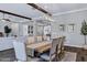 Bright dining room features a wooden table with seating for eight and decorative exposed wood beams at 3552 E Dogwood Dr, Chandler, AZ 85286