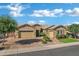 Charming single-story home featuring a well-manicured front yard and an attached two-car garage at 3552 E Dogwood Dr, Chandler, AZ 85286