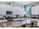 Close-up of a modern kitchen featuring granite countertops, stainless appliances, and pendant lighting at 3552 E Dogwood Dr, Chandler, AZ 85286