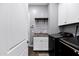 Functional laundry room with cabinets, sink, and modern washer and dryer at 3552 E Dogwood Dr, Chandler, AZ 85286