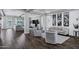 Open-concept living area with dark floors, coffered ceilings, and neutral decor at 3552 E Dogwood Dr, Chandler, AZ 85286