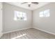 This bedroom features light walls and trim, and new wood-look flooring at 3824 N 8Th Ave, Phoenix, AZ 85013