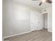 This bedroom features neutral walls, white trim, and light, wood-look flooring at 3824 N 8Th Ave, Phoenix, AZ 85013