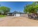 Single-story home with an expansive parking area and block wall at 3824 N 8Th Ave, Phoenix, AZ 85013
