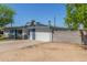 Single-story home with an expansive parking area and block wall at 3824 N 8Th Ave, Phoenix, AZ 85013