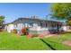 Single-story home with well-maintained landscaping and a lush lawn at 3824 N 8Th Ave, Phoenix, AZ 85013