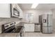 Modern kitchen featuring stainless steel appliances, sleek countertops, and white cabinets at 3824 N 8Th Ave, Phoenix, AZ 85013