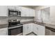 Modern kitchen featuring stainless steel appliances, sleek countertops, and white cabinets at 3824 N 8Th Ave, Phoenix, AZ 85013