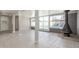Bright living room featuring a modern fireplace, tile floors, and large windows offering a pool view at 3824 N 8Th Ave, Phoenix, AZ 85013