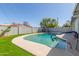 This refreshing pool features a baja-style entry, green grass and privacy fence at 3824 N 8Th Ave, Phoenix, AZ 85013