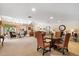 Inviting common area with comfortable seating, tables, and a view of the garden through a large window at 4200 N Miller Rd # 228, Scottsdale, AZ 85251