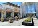 Charming outdoor dining area with potted plants and modern building facade for a refined ambiance at 4200 N Miller Rd # 228, Scottsdale, AZ 85251