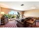Comfortable living room featuring an arched window, sofa, and stylish furniture perfect for relaxation at 4200 N Miller Rd # 228, Scottsdale, AZ 85251