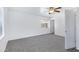 Bedroom with carpet, windows, and ceiling fan, all neutrally painted at 43232 W Magnolia Rd, Maricopa, AZ 85138