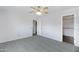 Bedroom featuring a ceiling fan and access to a walk-in closet at 43232 W Magnolia Rd, Maricopa, AZ 85138