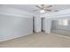 Spacious bedroom with soft carpet, ceiling fan and mirrored closet at 43232 W Magnolia Rd, Maricopa, AZ 85138
