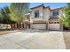 Charming two-story home featuring stucco finish, tile roof, a three-car garage, and well-maintained landscaping at 43232 W Magnolia Rd, Maricopa, AZ 85138