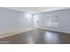 Spacious living room with neutral walls, offering lots of natural light at 43232 W Magnolia Rd, Maricopa, AZ 85138
