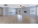 Large room with tile floors, ceiling fan, and outdoor access for comfortable living at 43232 W Magnolia Rd, Maricopa, AZ 85138