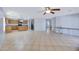 Open-concept living room showcasing neutral paint, tile floors, and an airy atmosphere at 43232 W Magnolia Rd, Maricopa, AZ 85138